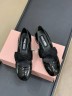 Туфли Miu Miu из лакированной кожи с бантом